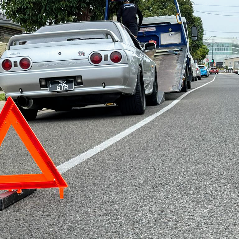 Adelaide On Call Towing tilt-tray tow truck recovering a Nissan Skyline GT-R in Adelaide